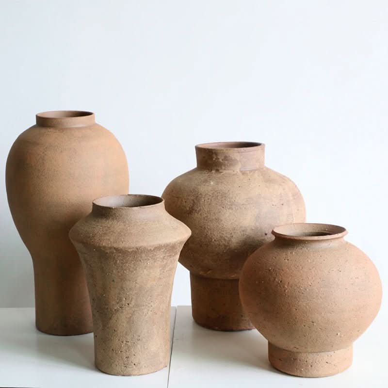 Cylindrical Curved Clay Brown Vase - Earthenware home decor accent piece with rustic texture.
